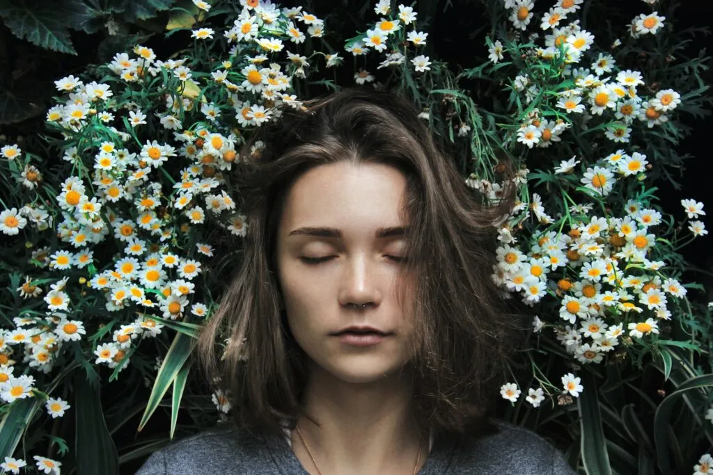 Woman with plants on background