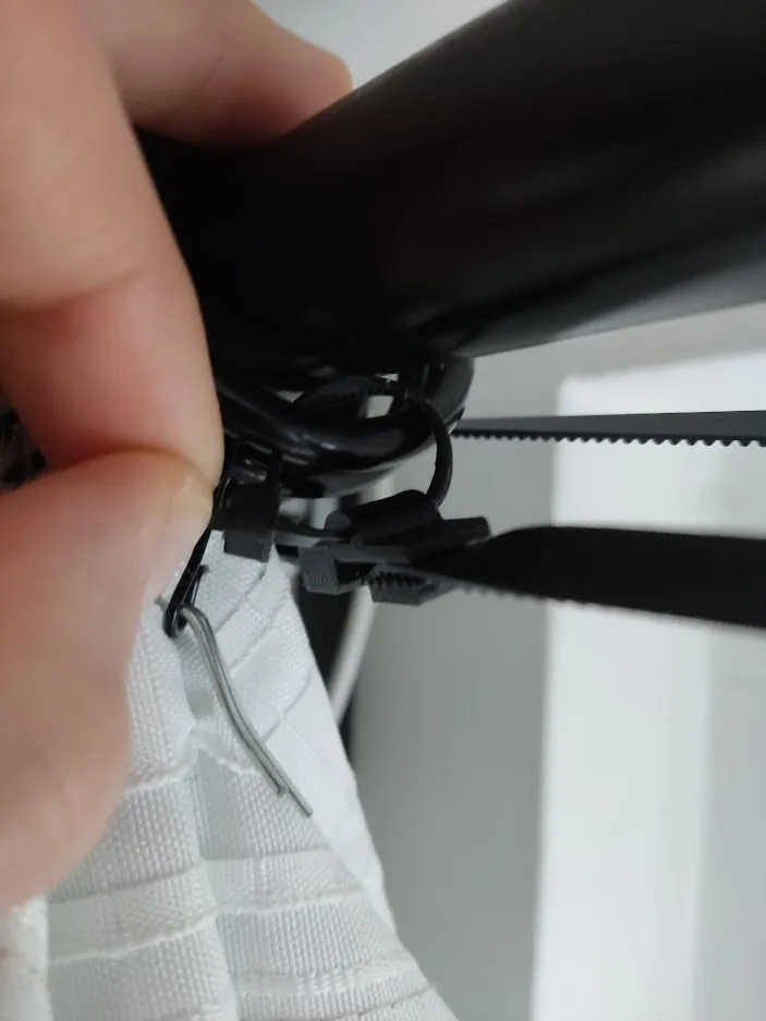 Picture of the clip that connects the timing belt to the curtain.