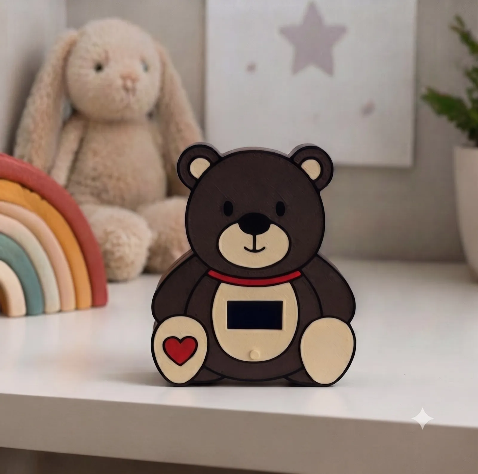 The Wishly WensBeer, a teddy bear with red accents and a small screen
